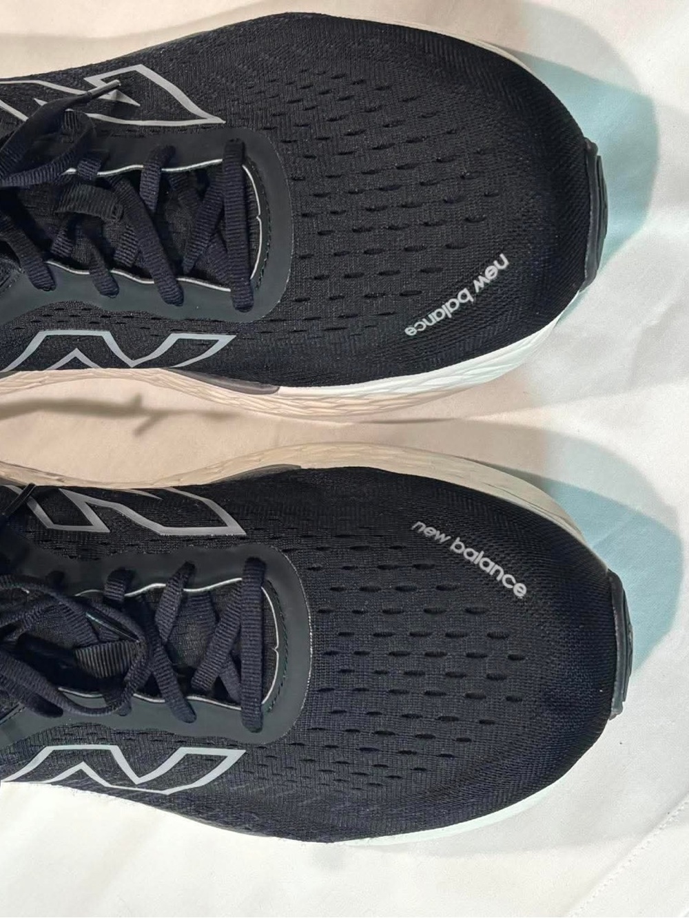 New Balance Men’s Black and White Running Sneakers